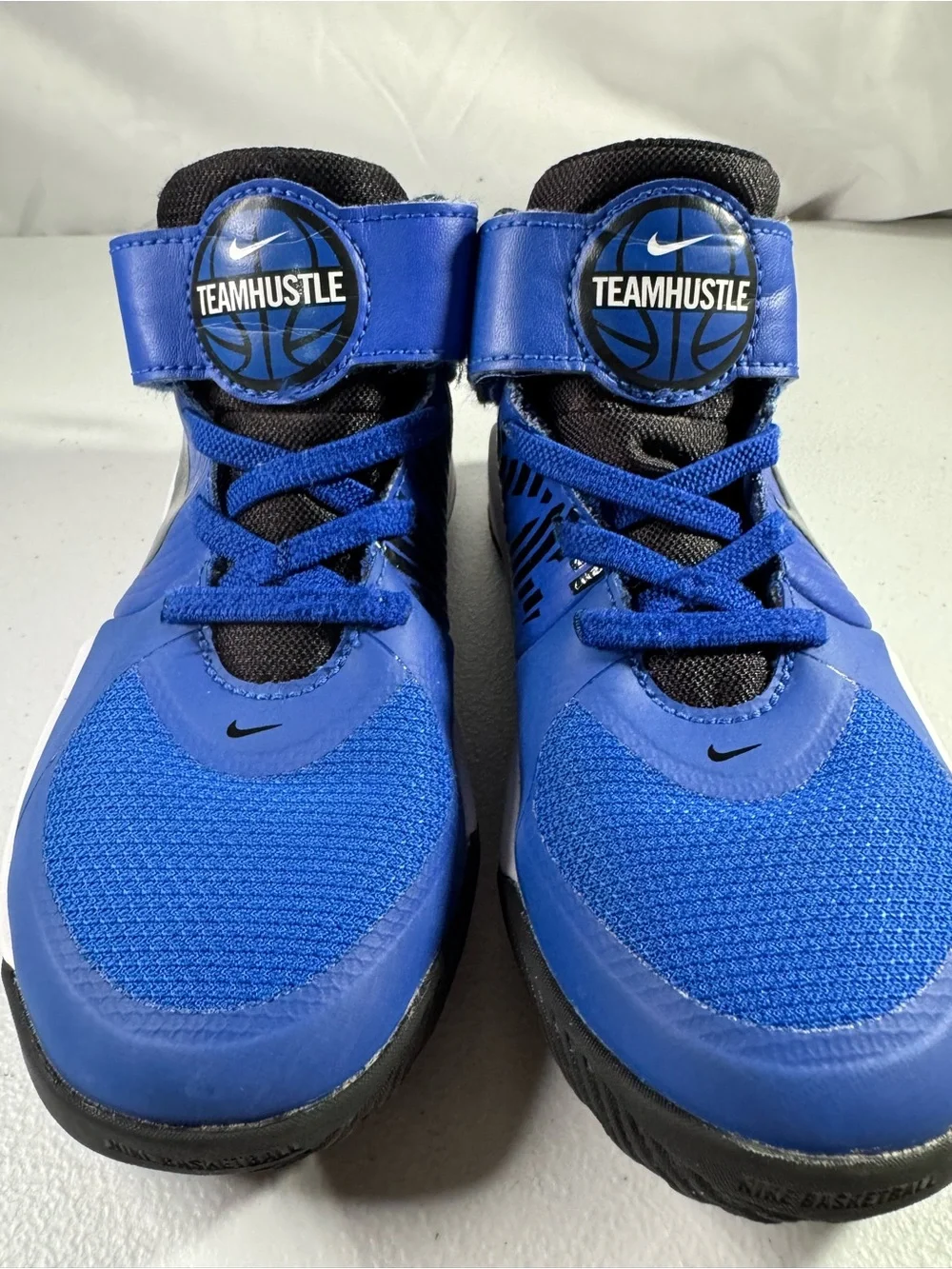 Nike Team Hustle Kids' High-Top Sneakers in Royal Blue and Black